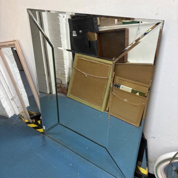 Large Art Deco wall mirror with clean lines and reflective surface.