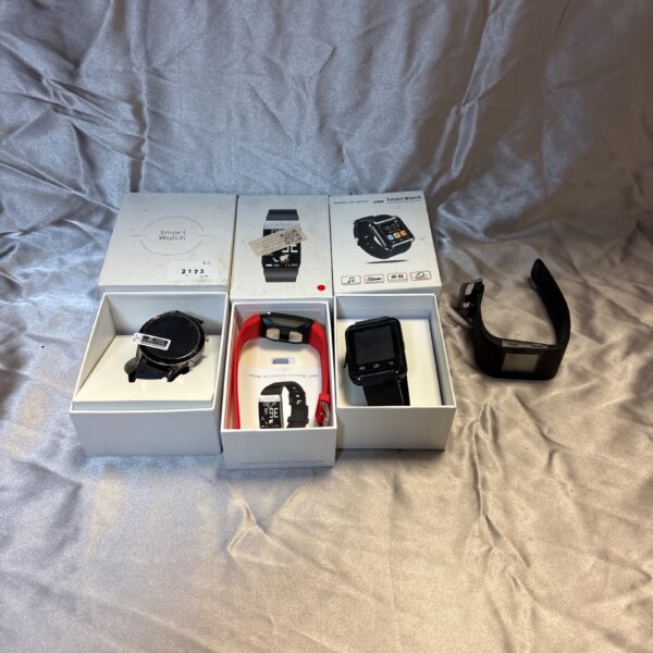 Close-up of a lot of four unbranded smart watches.