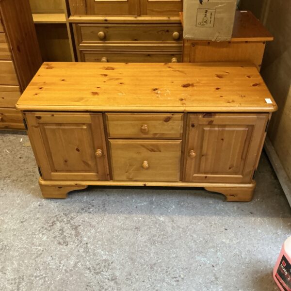 Vintage low pine sideboard with cupboard doors.