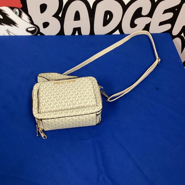 Stylish Michael Kors handbag with quilted pattern and adjustable strap.