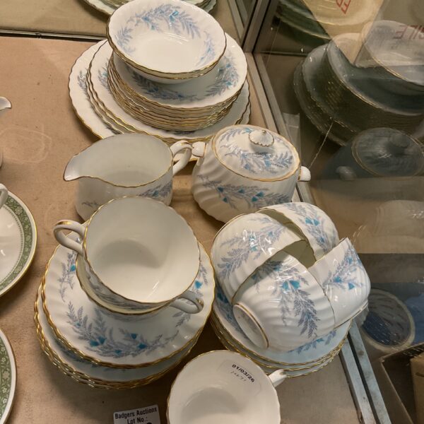 Antique Minton Belbrachen tea set displayed on a table.