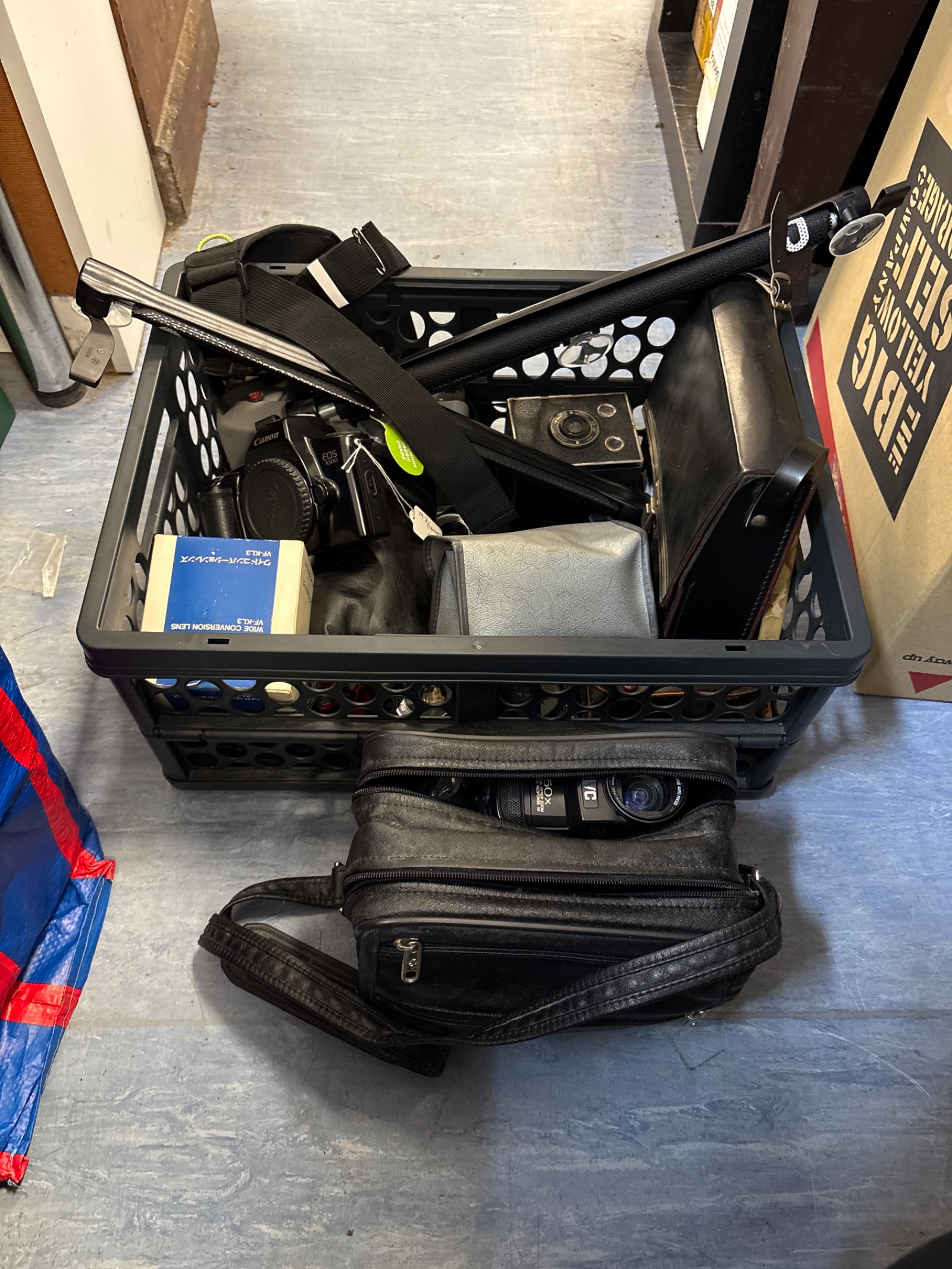 219 Box full of mixed cameras and accessories, including Canon and JVC