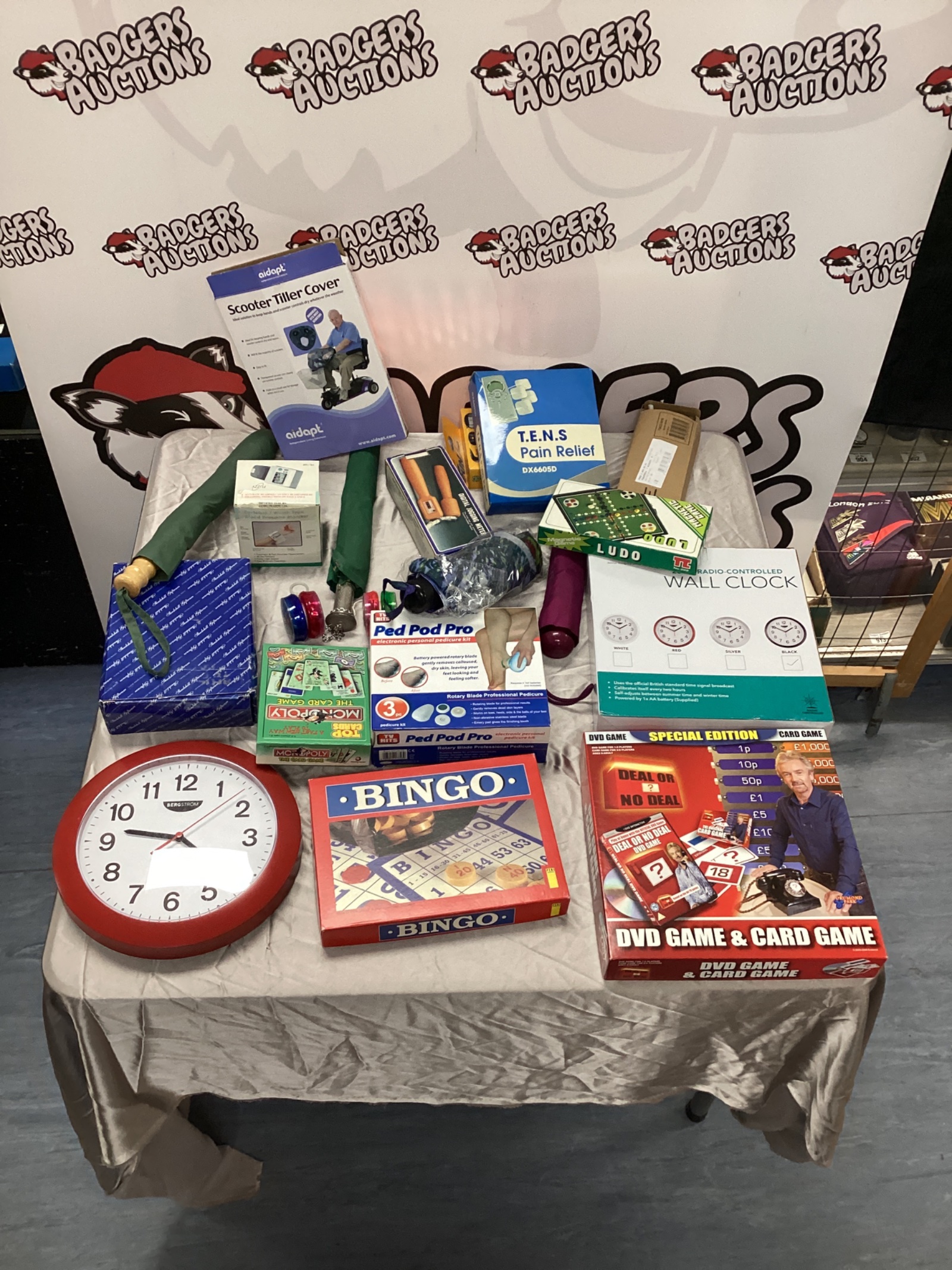 710 Box-of mixed inc deal or no deal game & umbrellas