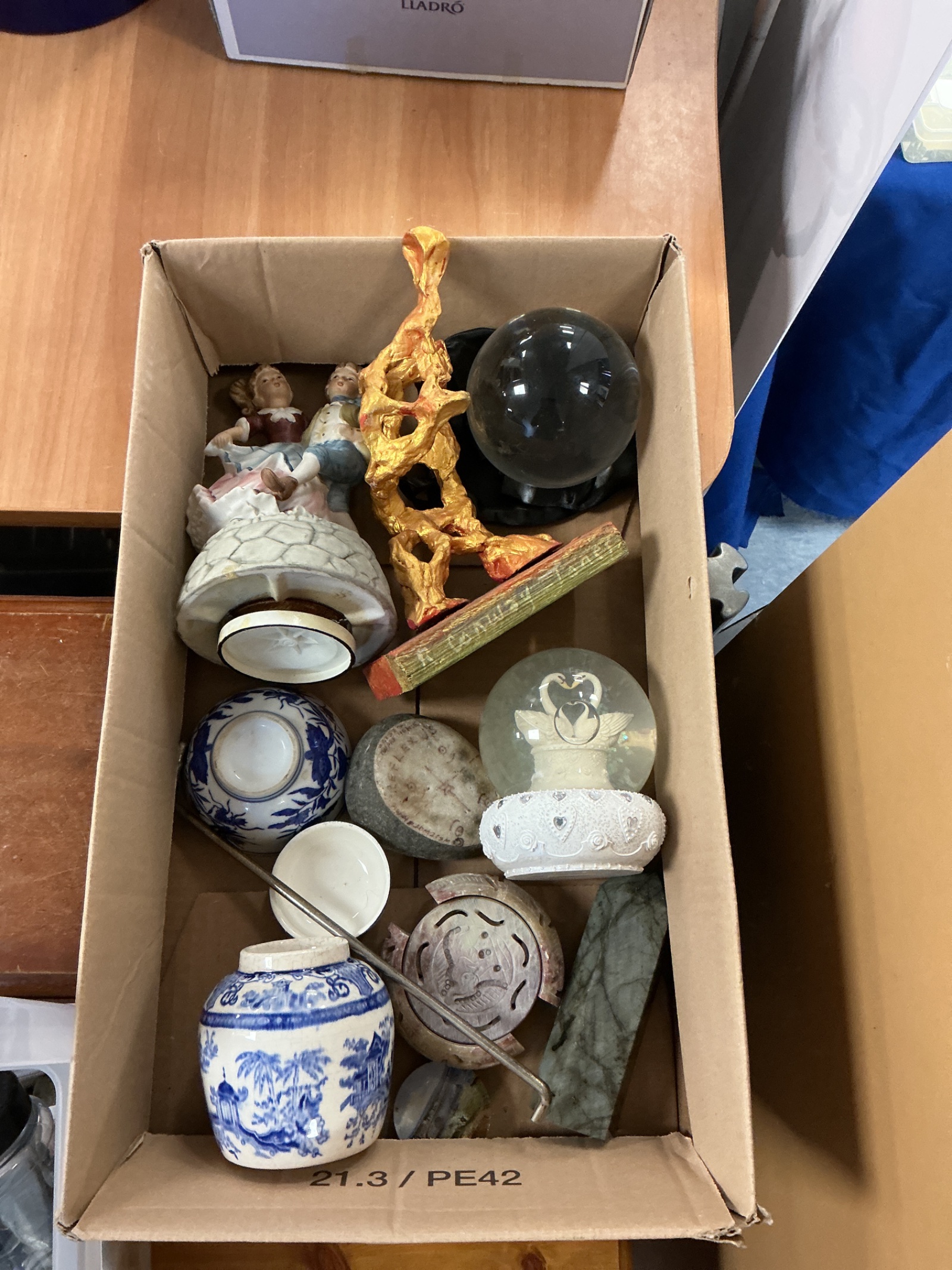 325 Box of mixed ornaments and figurines inc Labradorite crystal tower and a crystal ball with black protective bag