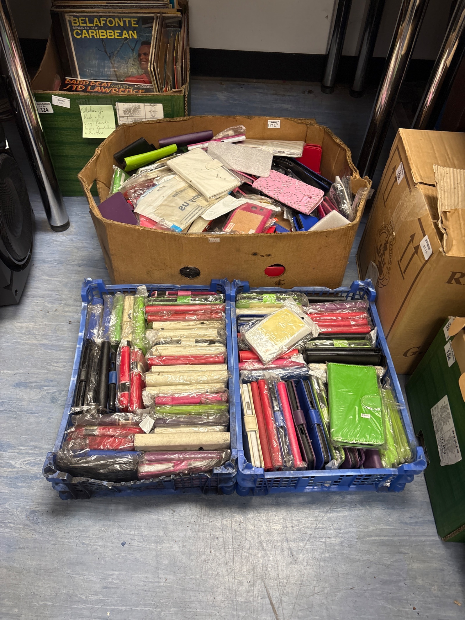 125 Three trays full of mixed mobile phone cases, including New