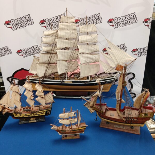 Detailed overview of a model ship collection including HMS Victory.