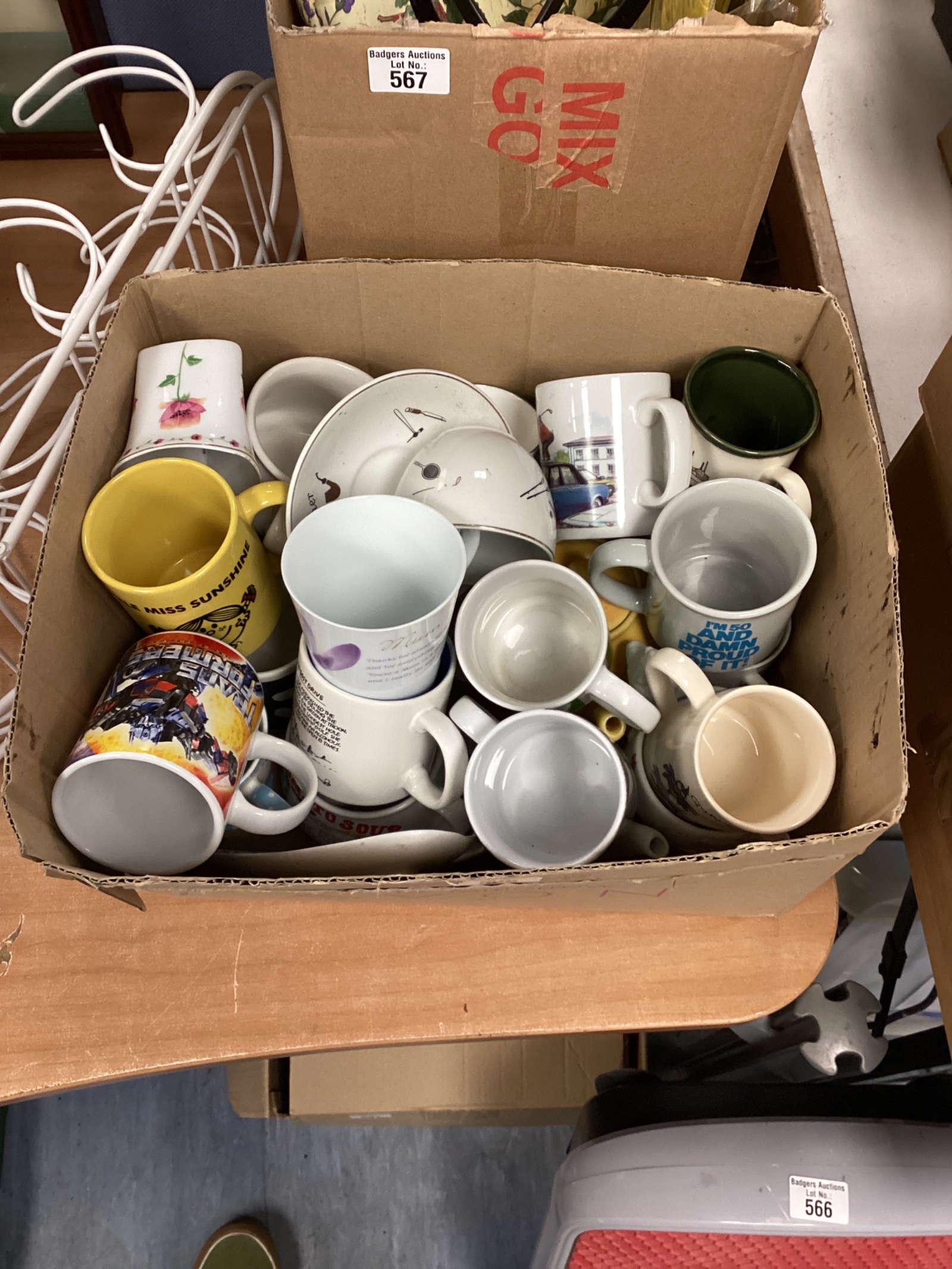 568 Vauxhall of novelty mugs, including Mr. Men and Transformers.