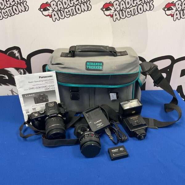 Panasonic Lumix DMC-G3 digital camera with case and accessories.