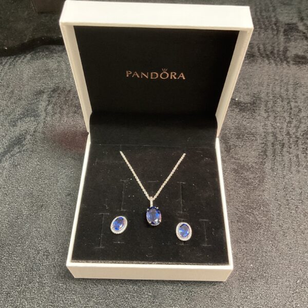 Pandora sterling silver cubic zirconia halo necklace and earring set displayed.