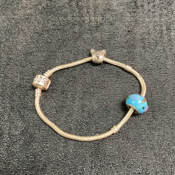Silver Pandora bracelet with two colourful glass beaded charms.