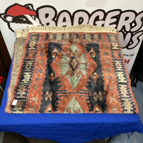 Detailed view of a vintage Persian runner rug with intricate patterns.