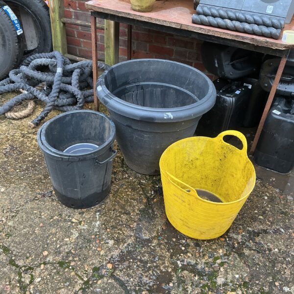 Lot of three plastic garden planters for outdoor use.