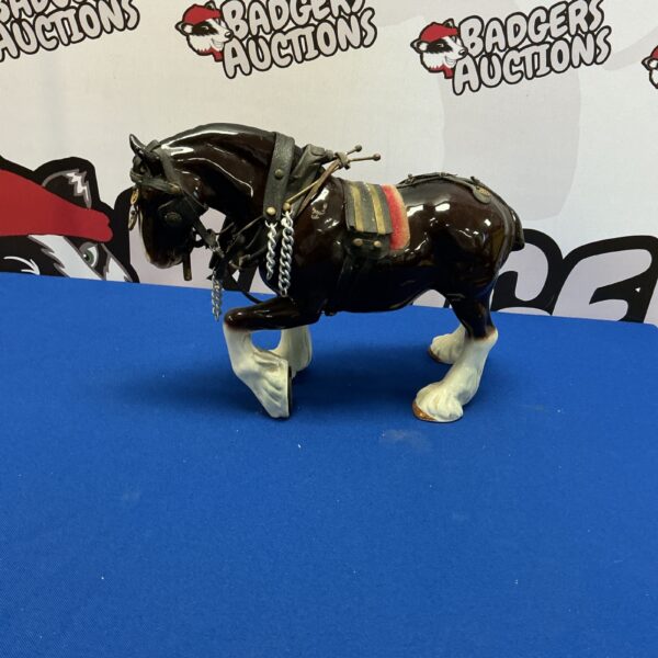 Detailed porcelain Shire horse figurine, a beautiful collectible statue.