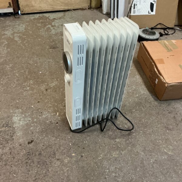 Front view of a used portable electric panel heater.