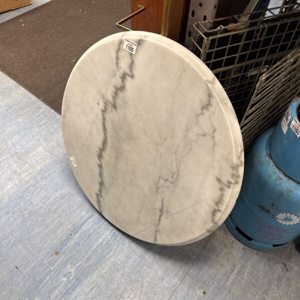 Round marble table top with veining, ideal for furniture projects.