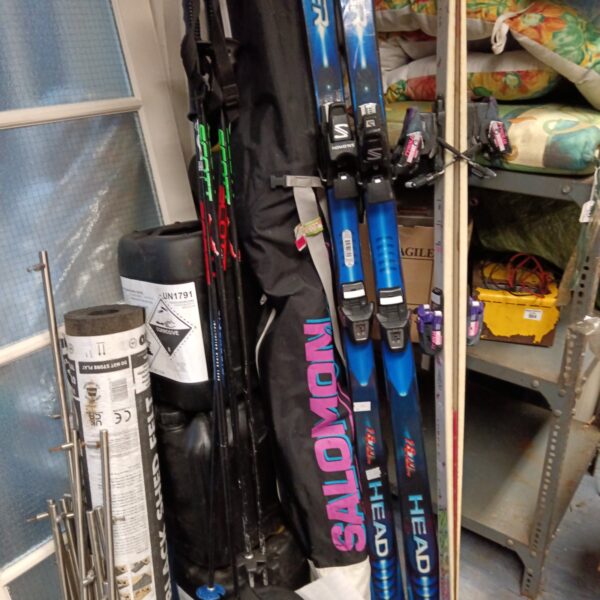 Used Salomon and Head ski and pole lot for winter sports.