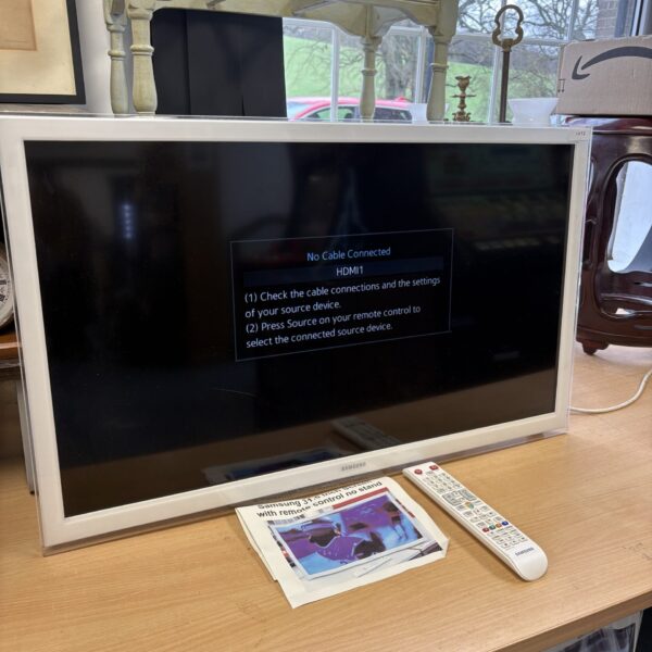 Samsung 31.5 inch monitor with remote control displayed.