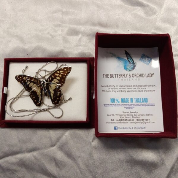 Close-up of Samui Jewellery butterfly orchid lady necklace pendant.