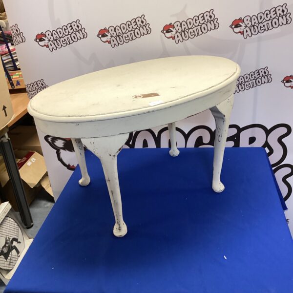 Distressed white shabby chic oval coffee table for farmhouse decor.