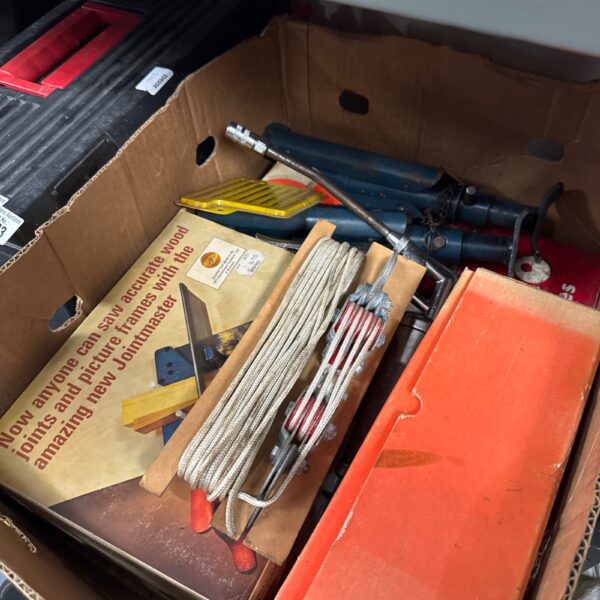 Shed clearance lot with axle stands and workshop tools.