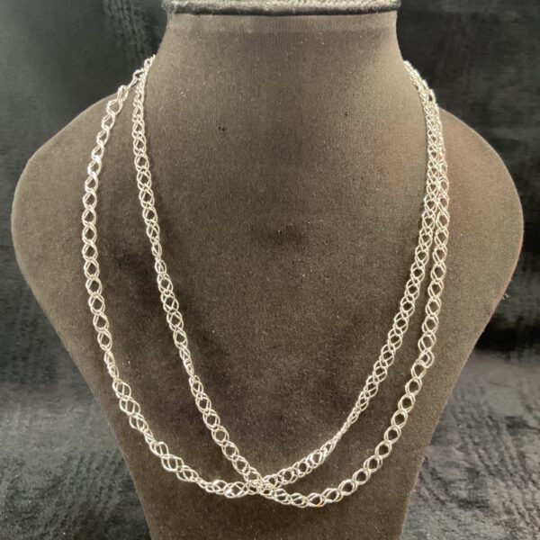 Two 925 silver double link necklaces on a display.