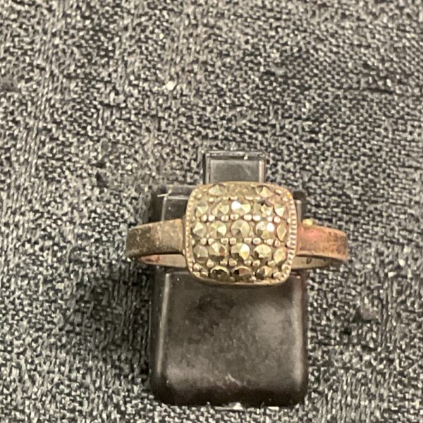 Close-up of a vintage silver markasite ring with a stone cluster.