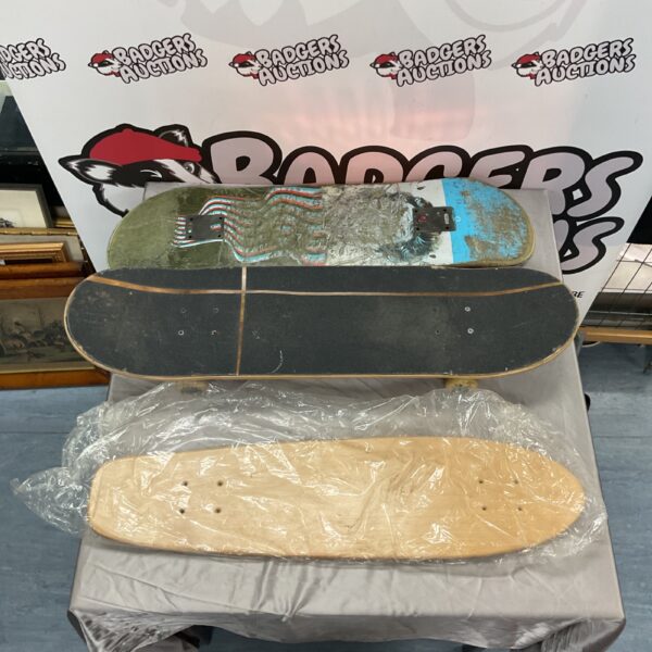 Vintage skateboards lot with worn decks and graphics.