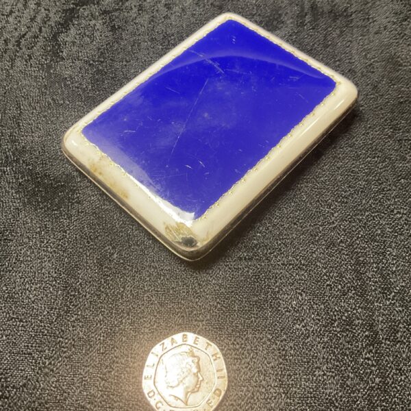 Vintage sterling silver cigarette case with blue enamel.