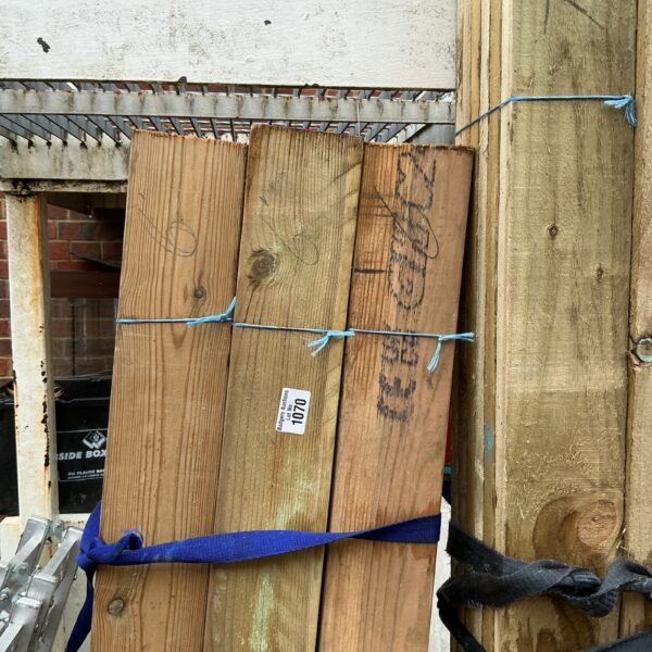 Strapped bundles of timber ready for construction or DIY projects.