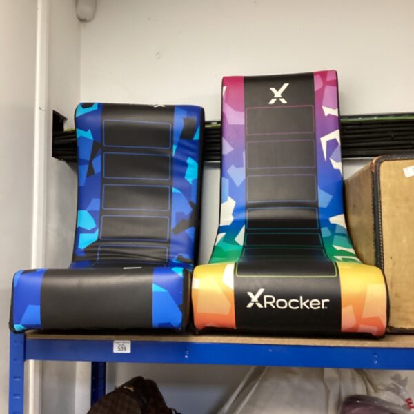 Two colourful X Rocker gaming chairs presented for auction.