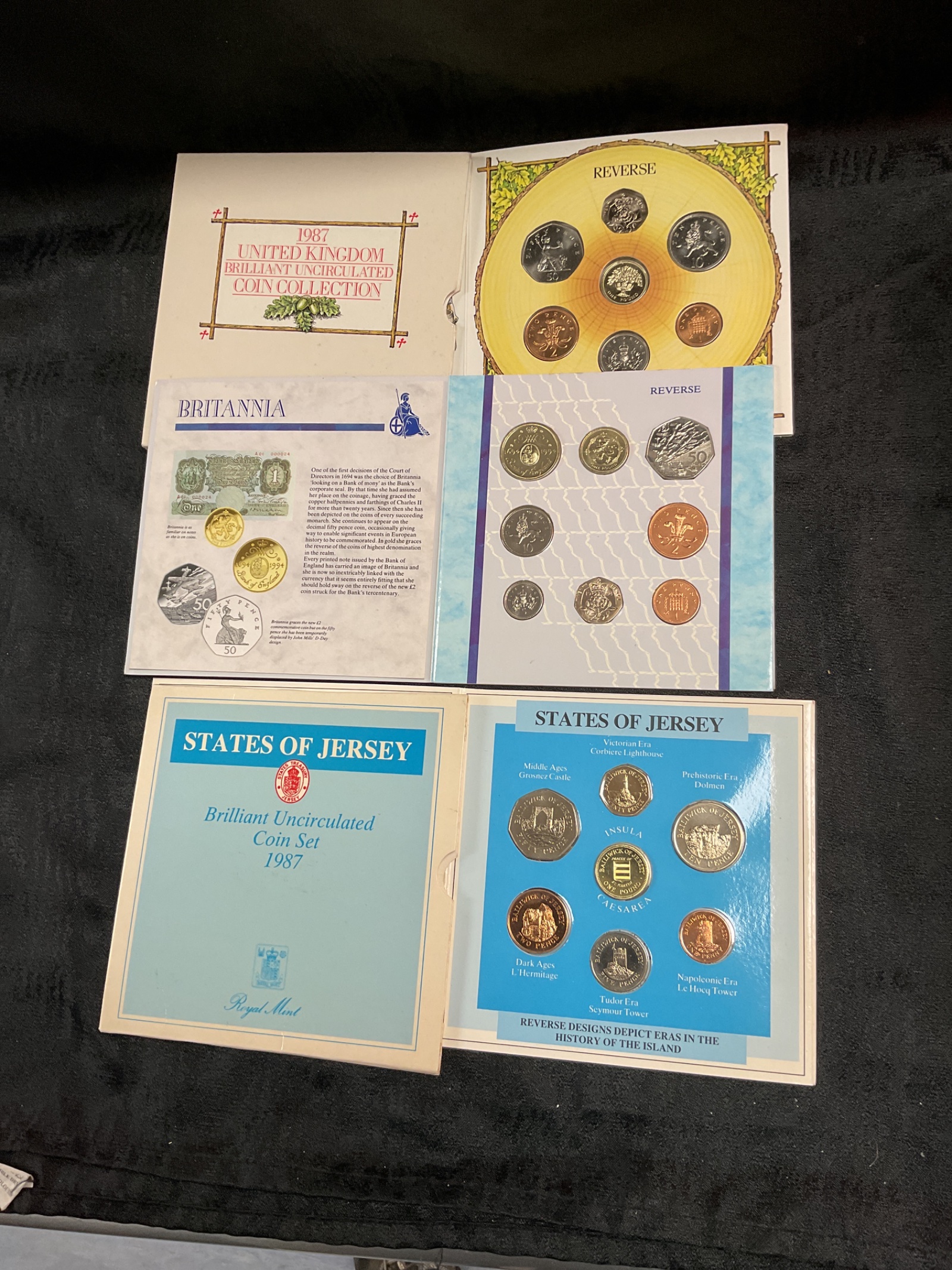 848 Three sets of United Kingdom brilliant uncirculated coin collections UK 1987 and 1994 and states of Jersey 1987