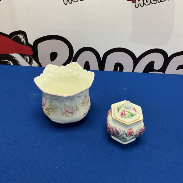 Delicate Victorian porcelain flower pot with floral design.