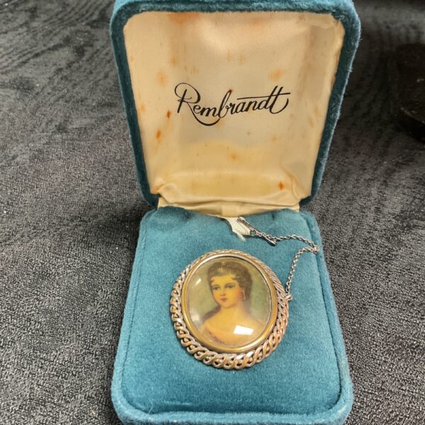 Victorian Rembrandt style portrait brooch with yellow metal mount.