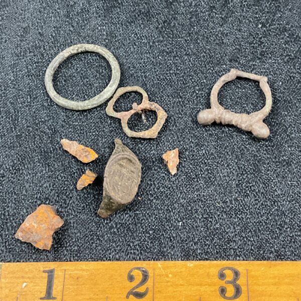 Viking ring and associated metal fragments from a museum collection.