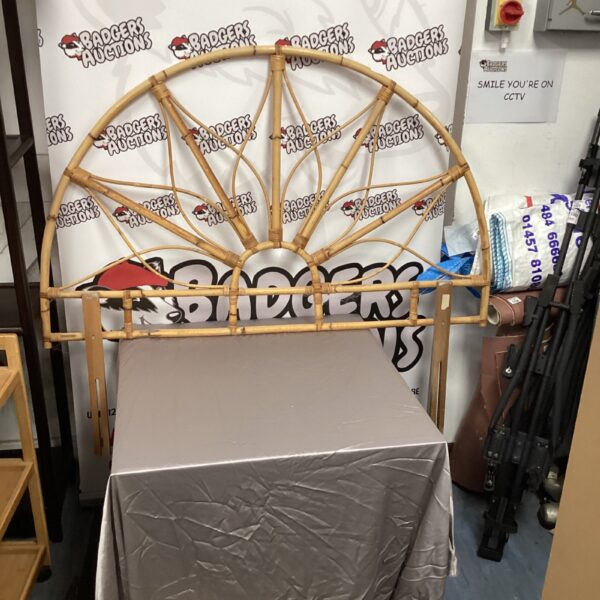 Vintage circular bamboo backboard with woven design.