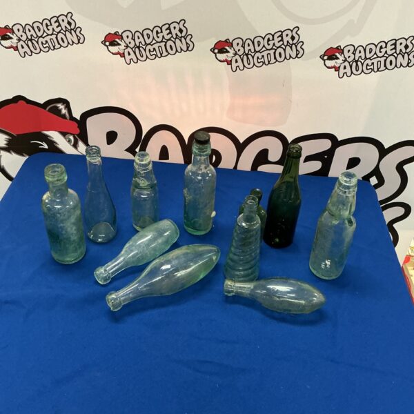 Vintage bottle collection with various shapes and sizes.