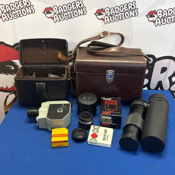 Vintage camera accessories lot including lenses and film camera.
