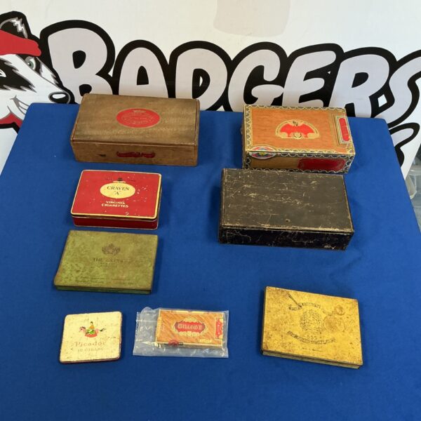 Selection of vintage cigar boxes, collectible tin boxes, tobacco advertising.