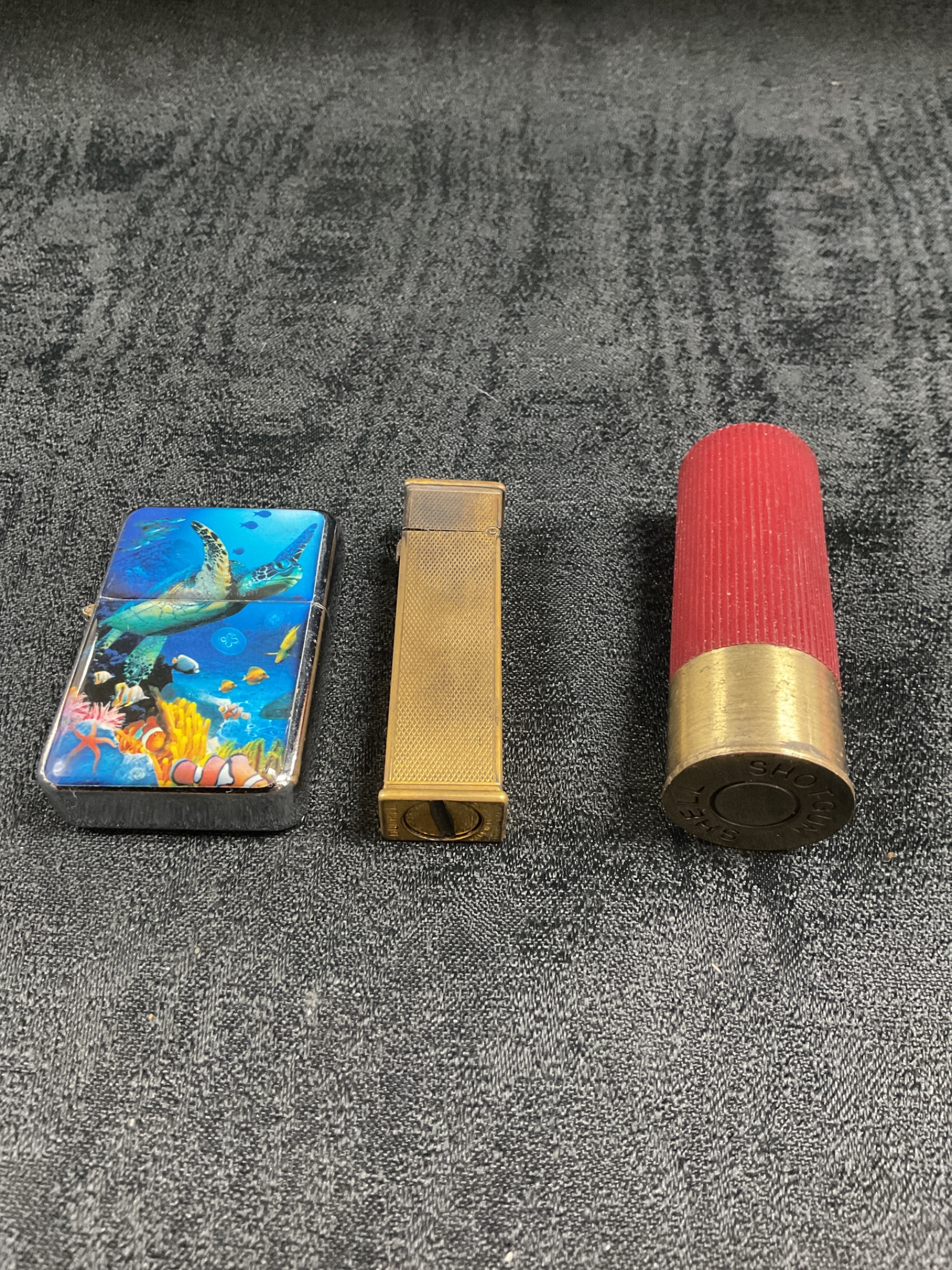 906 Three Cigarette lighters inc vintage dunhill and shotgun shell lighters