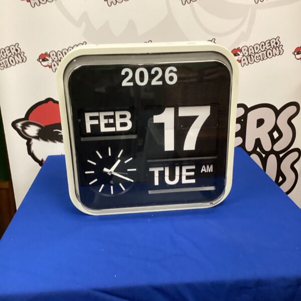 Vintage commercial day date clock displaying February 17th.