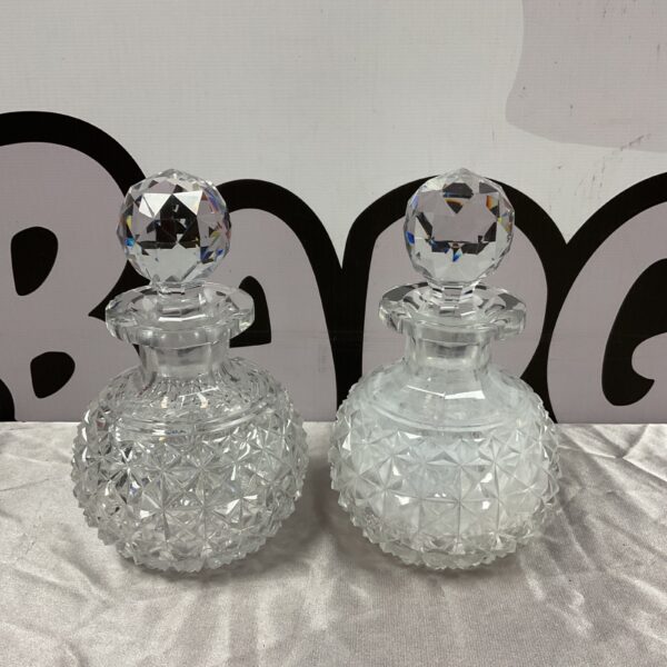 Pair of vintage crystal decanters with hobnail pattern.