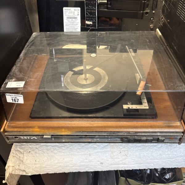 Vintage HMV record player with wooden cabinet and turntable.