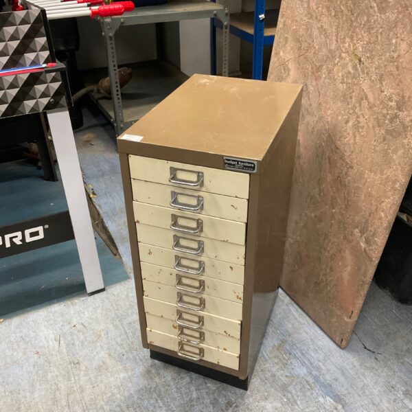 Vintage metal machinist cabinet with ten drawers for tool storage.