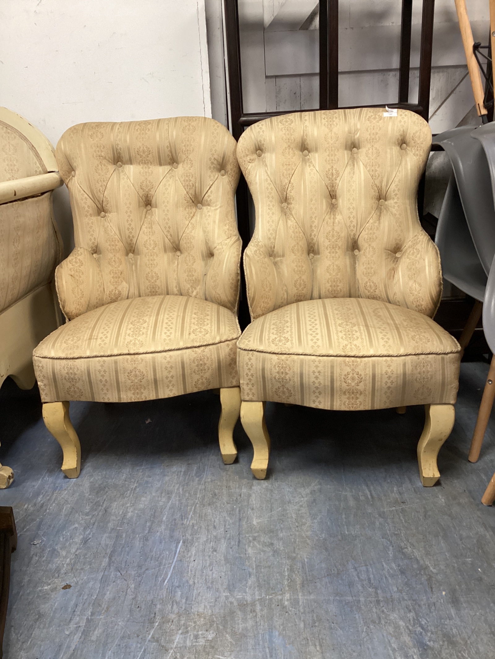 564 Two vintage deep buttoned parlour chairs