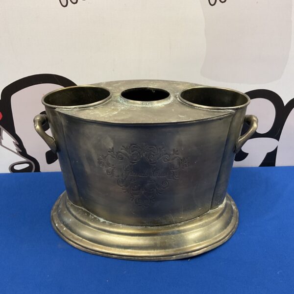 Vintage silver plate wine bottle holder with handles.