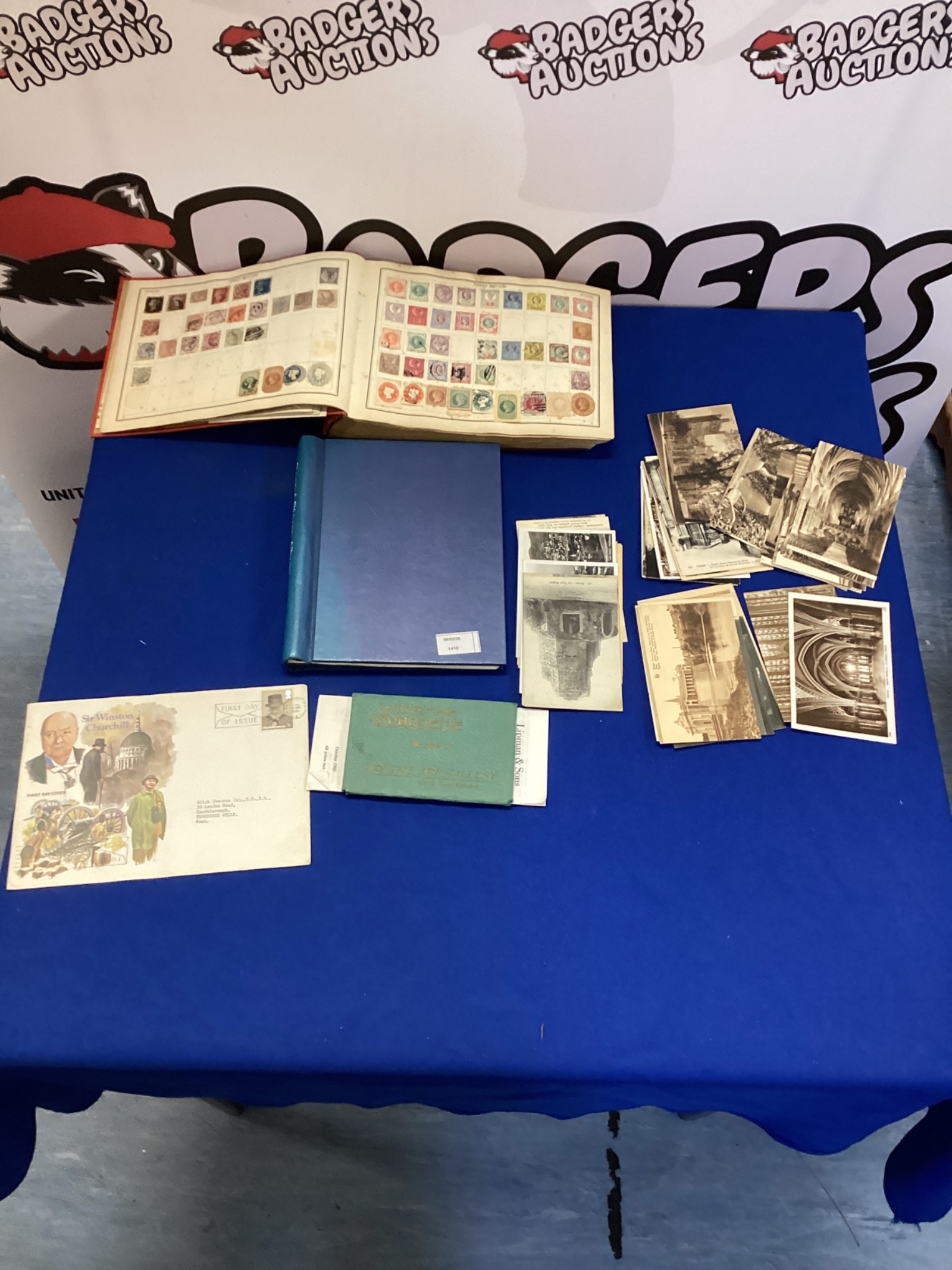 504 Two vintage stamp albums with stamps & a small bundle of postcards
