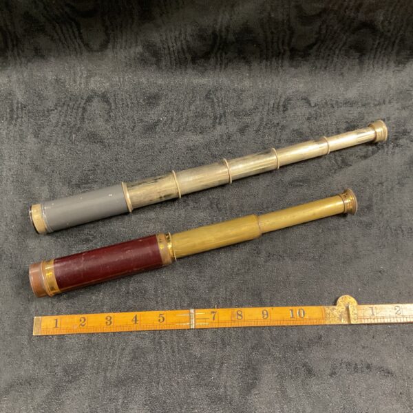 Brass three-draw vintage telescope, antique nautical instrument.