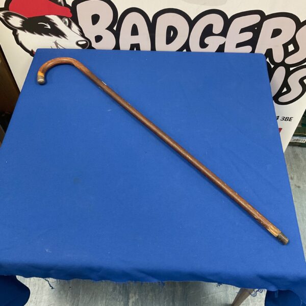 Vintage walking stick with a detailed silver knop handle.