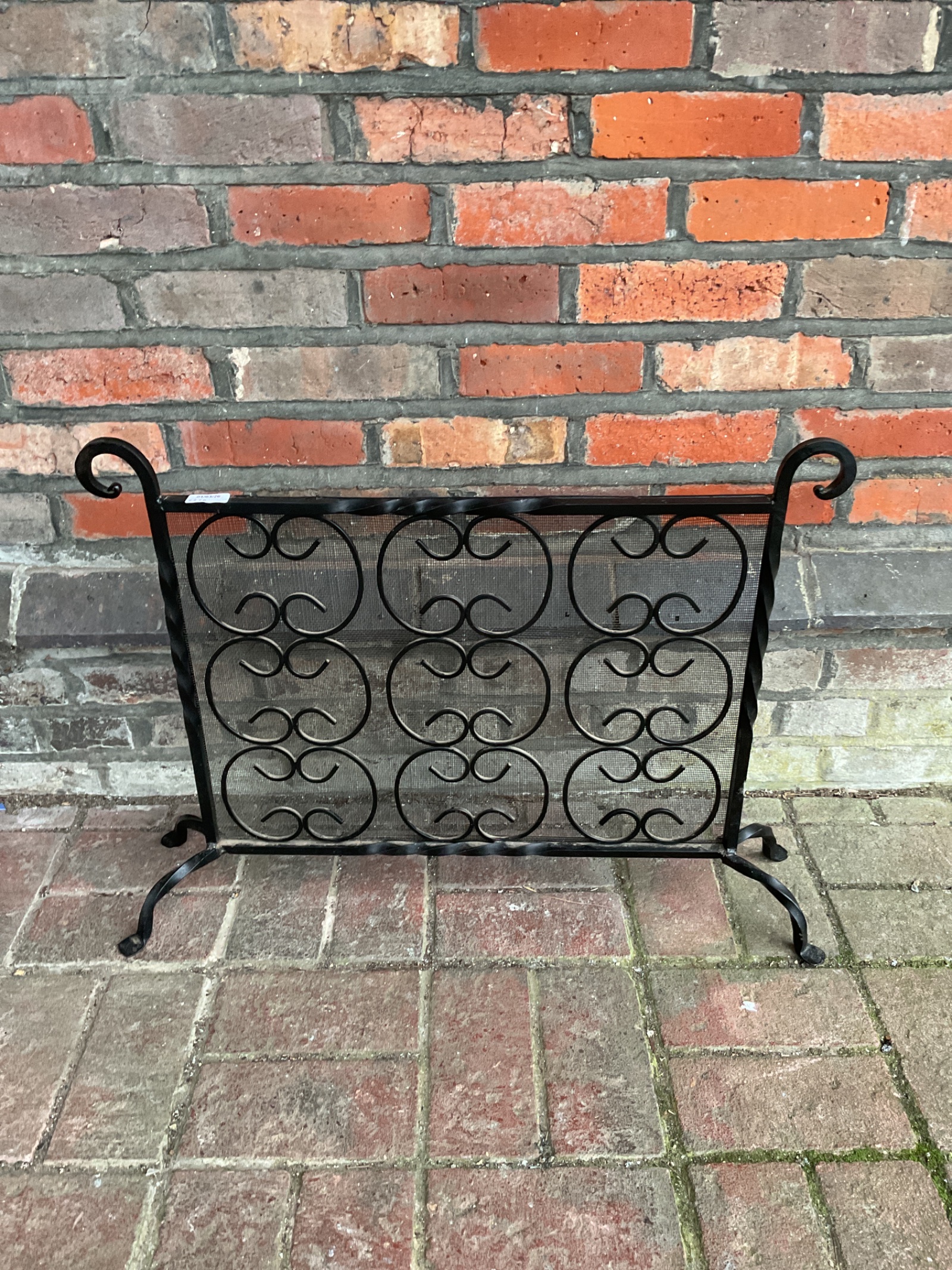 080 Wrote iron and mesh fire screen 71cm x 55cm