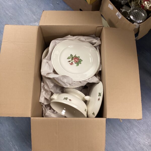 Vintage Wedgwood dinner service with floral plates and bowls.